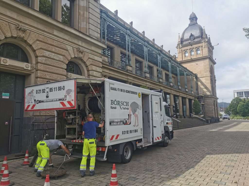 Property drainage Historische Stadthalle Wuppertal by IWR GmbH - Construction worker on a truck
