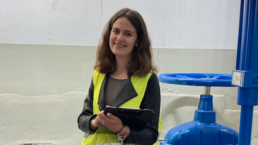 Federica Collini with clipboard in pumping station